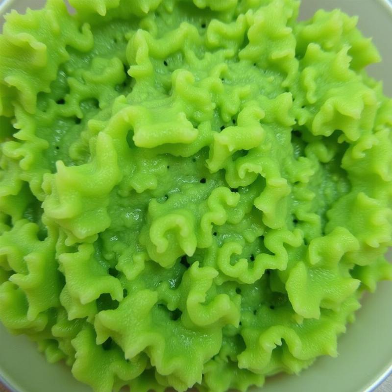 Raw green tripe for dogs: A close-up view of the unprocessed stomach lining of a cow, showcasing its texture and color.