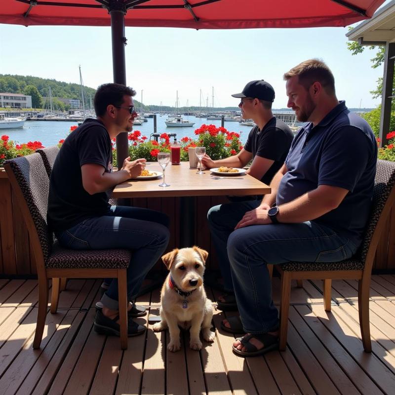 Dog sitting with owners on a patio at a Door County Restaurant